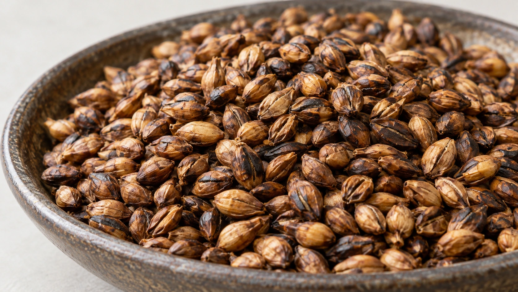 Original AI-generated macro photograph of roasted barley grains used for Mugicha infusion