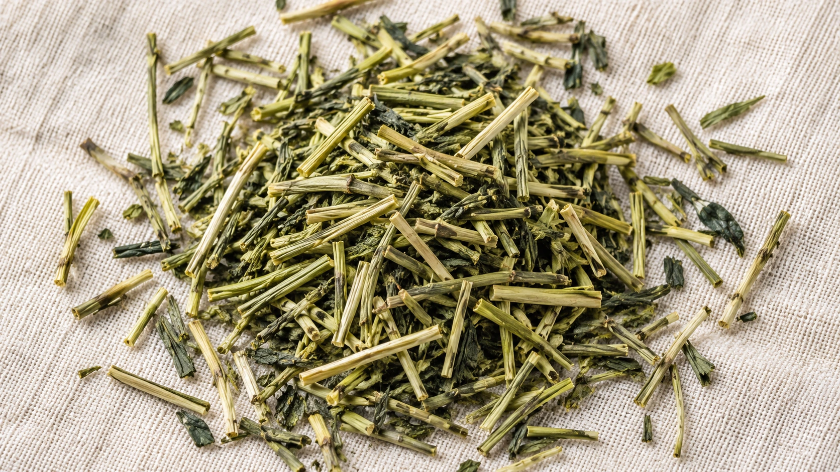 Original AI-generated editorial photograph of kukicha stem tea with pale stems and green leaf fragments on woven linen